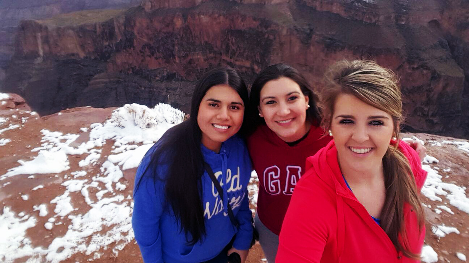 Johanna, Celeste & Daleen at the rim of the Grand Canyon with snow on the ground