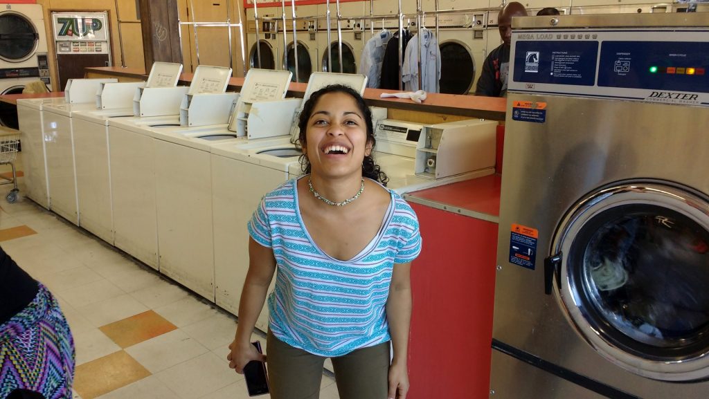 Eleo Rey posing and grinning at Launderland on Garvey Avenue in Rosemead, CA