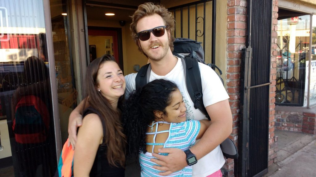 Tete, Lucas & Eleo hugging outside the Pawn Shop