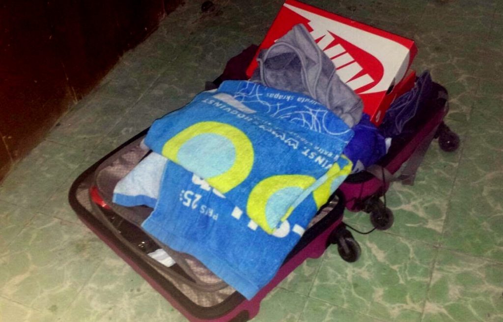 Photo of clothing placed in a suitcase