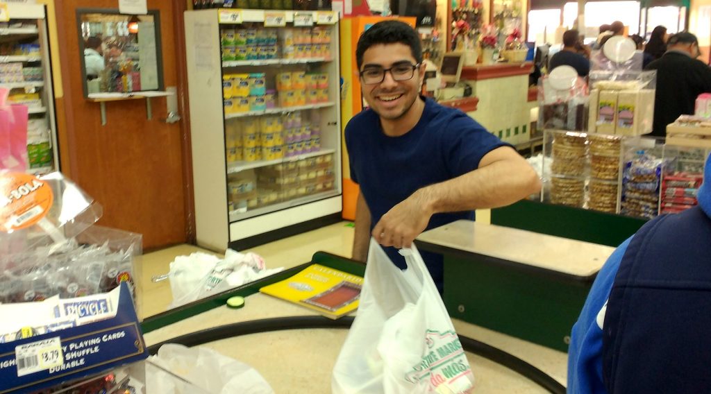 Davis at the checkout stand at Gonzalez Northgate market