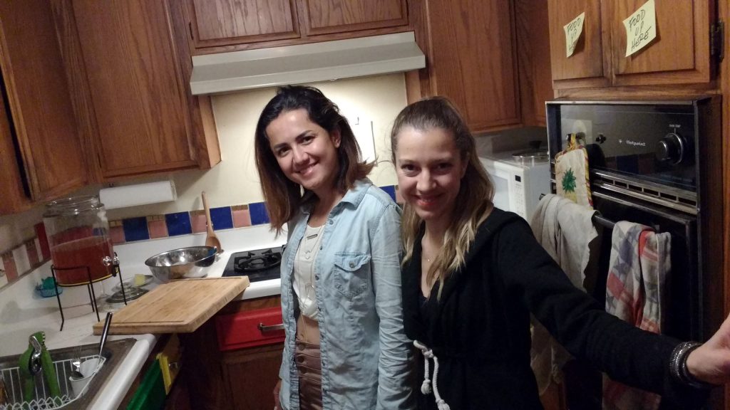 Gizem & Pinar standing and smiling in the RULA Kitchen