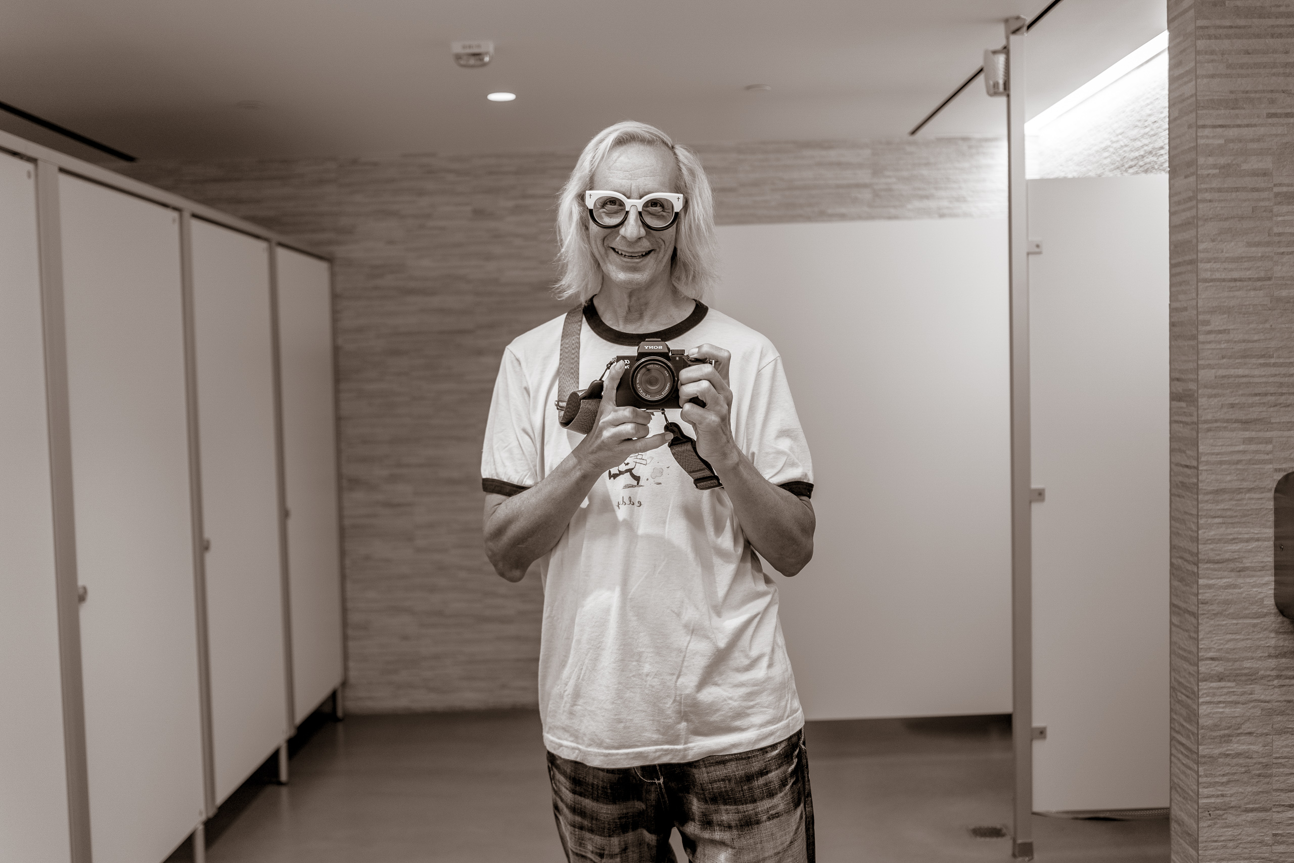 Glenn Zucman taking a selfie with a Sony a7iii camera in the mirror of the basement men's room at the Marciano Art Foundation on Wilshire Blvd in Los Angeles
