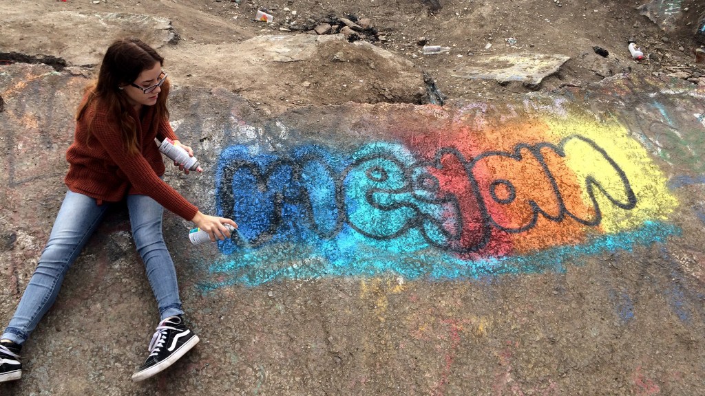 Megan Stevens writing her name in bubble letters