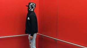 Ian Padilla in a large red elevator at LACMA