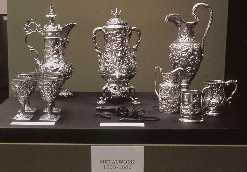 photo of Fred Wilson's exhibition Mining the Museum featuring various metal works from the Maryland Historical Society's archives
