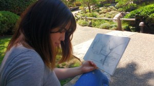 Lisa Bernhauser sketching a landscape at the CSULB Japanese Garden