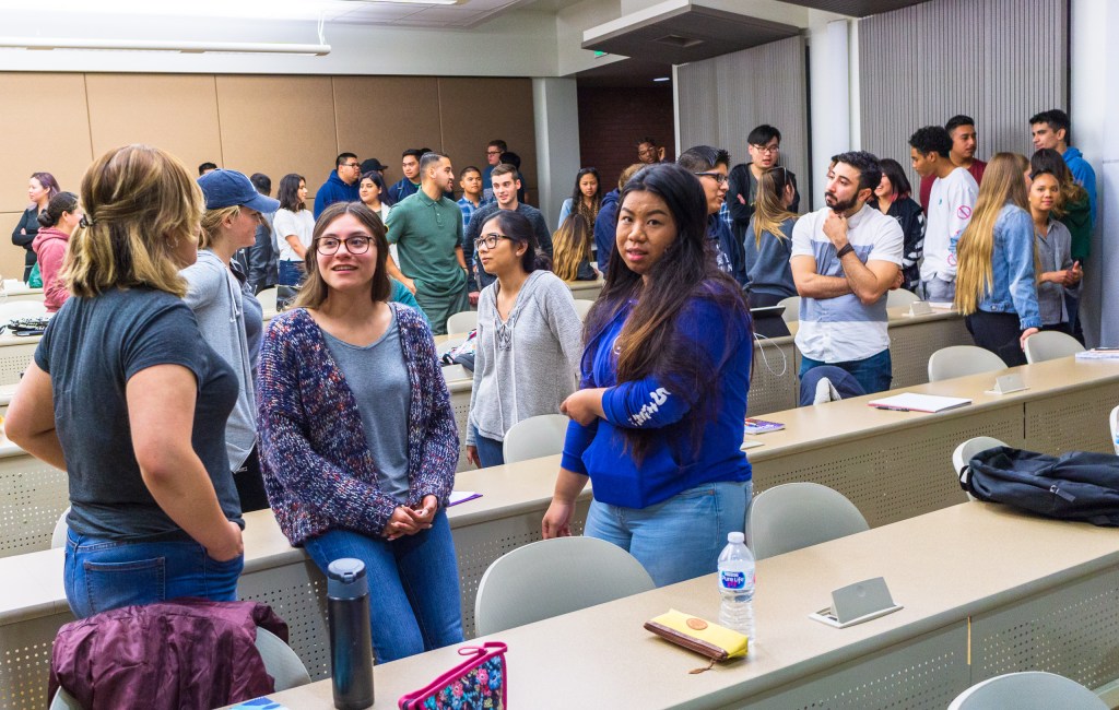 students in conversation in the MM-200 Classroom at Long Beach State University