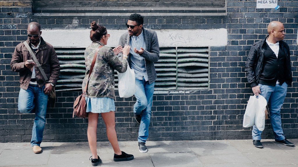 group of people chatting on a London street in 2013