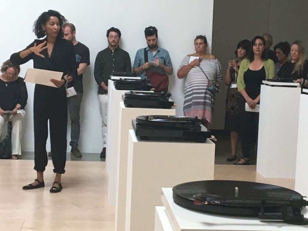 photo of lauren woods speaking at the opening of American MONUMENT