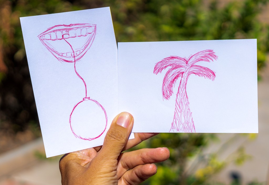 photo of 2, 4x6 index cards, each with a drawing in red ballpoint pen