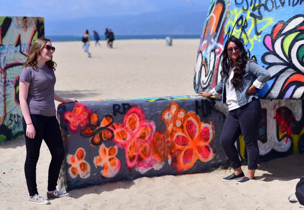 Rachel Palmer & Maria Romo standing at the Art Walls at Venice Beach, CA